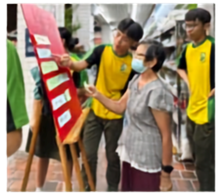Secondary 4 students sharing health tips at the Khatib Square.